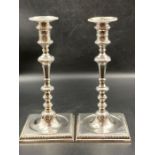 A Pair of George II silver candlesticks (H 26cm)