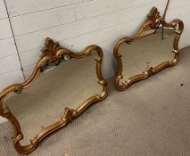 A pair of scrolling over mantle mirrors (74cm x 81cm)