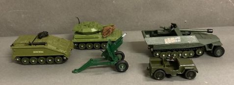 Five unboxed military toy vehicles to include Dinkey