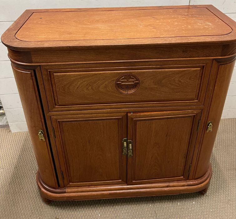 A chinese hardwood drinks cabinet opening up to a bar height 96cm depth 50cm width 96cm