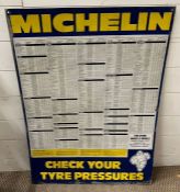 A vintage enamel adverting sign for Michelin showing tyre pressures (86cm x 62cm)