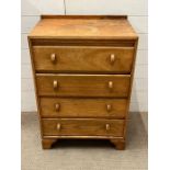 A light oak chest of drawers on bracket feet (H87cm W60cm D42cm)