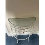 A Demi Lune wrought iron table with glass top (H74cm W62cm D26cm)