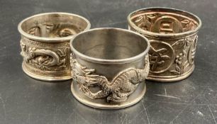 Three Chinese silver napkin rings
