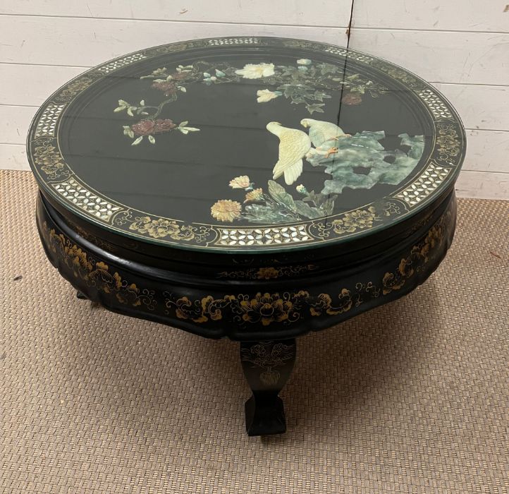 A Chinese black lacquer coffee table (H47cm Dia76cm)