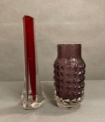A Whitefriars Aubergine pine cone glass vase and a ruby red three sided glass vase