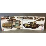 A Churchill crocodile tank model kit and a German eight ton semi truck