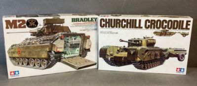 A Churchill crocodile tank model kit and a German eight ton semi truck