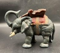 A Vintage style elephant money box in cast metal.