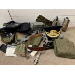A selection of reproduction military items including caps, hats, tin boxes