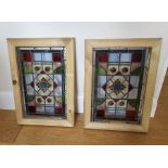 Two reclaimed stained glass window panels, framed 43xm x 29cm