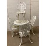 White metal garden table and four chairs