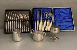 A selection of silver plated items to include two boxed sets of fish knives and forks, milk jug,