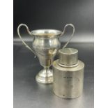 A hallmarked silver small trophy and a lidded canister