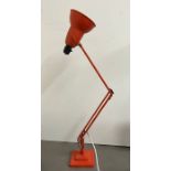 An Anglepoise orange lamp
