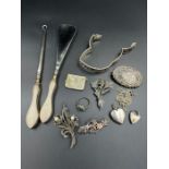 A small selection of silver jewellery and other silver items.