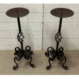 A pair of wrought iron candle sticks (H72cm)