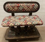 A South African carved bench seat with a Kilim style, upholstered and four carved birds to back