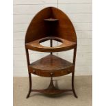 A mahogany corner wash stand on tapering legs (H123cm D45cm)