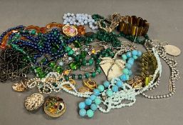 A selection of costume jewellery to include necklaces and jewellery