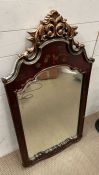 A red lacquered and gilt framed contemporary mirror (120cm x 64cm)