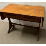 A Mid Century drop sided side table (H73cm W93cm D48cm)