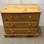 A pine chest of drawers, two over two (H62cm W75cm D41cm)