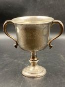 A two handled engraved silver trophy, hallmarked for Birmingham 1925 (Approximate Total weight