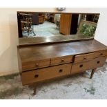 Mid Century dressing table, four small drawers and two large drawers under on tapering legs (