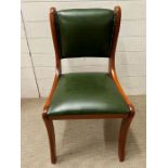 A green faux leather desk chair