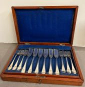 A mahogany case set of white metal fish knives and forks