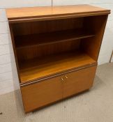 A Mid Century open bookcase with cupboard under (H103cm W91cm D38cm)