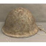 A British military helmet dated 1973