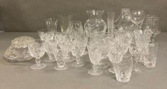 A selection of glassware to include wine glasses, vases and brandy balloons