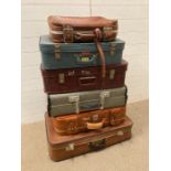 Six vintage suitcases ideal for display or prop