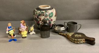 A mixed selection of various items to include Disney figures, a Studio Pottery vase and a