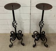 A pair of wrought iron candle sticks (H72cm)