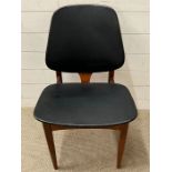An Elliott's of Newbury Mid Century chair with black vinyl seat pads