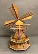 A decorative wooden model of a windmill