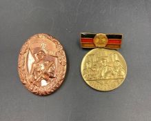 Two East German military medals.