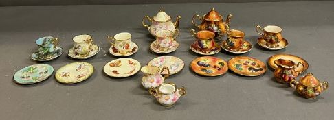 A collection of miniature china by Lime House Studio, tea cups, tea pots etc, various designs