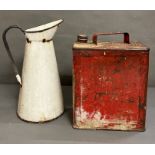 An enamel pitcher jug (H36cm) and a vintage red petrol can (H29cm)