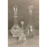 Two glass decanters and a cut glass bell