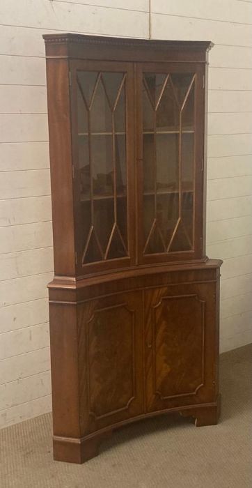 A mahogany glazed corner cabinet with cupboard under (H180cm W80cm)