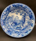 Blue and White bowl with country scene with rabbits 29cm diameter and 12 cm high.