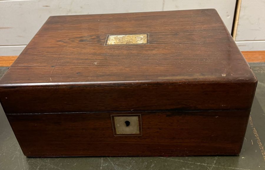 A rosewood dressing table box with fitted jewellery compartments