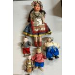 A selection of dolls including folk-art dolls