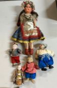 A selection of dolls including folk-art dolls