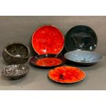 A selection of glazed Swiss Studio pottery in lava reds, greys and blues