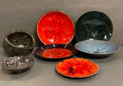 A selection of glazed Swiss Studio pottery in lava reds, greys and blues